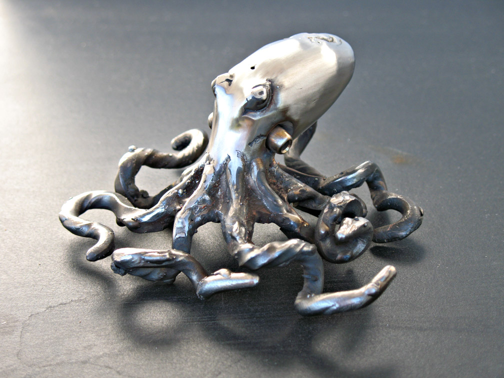 small forged stainless steel octopus sculpture